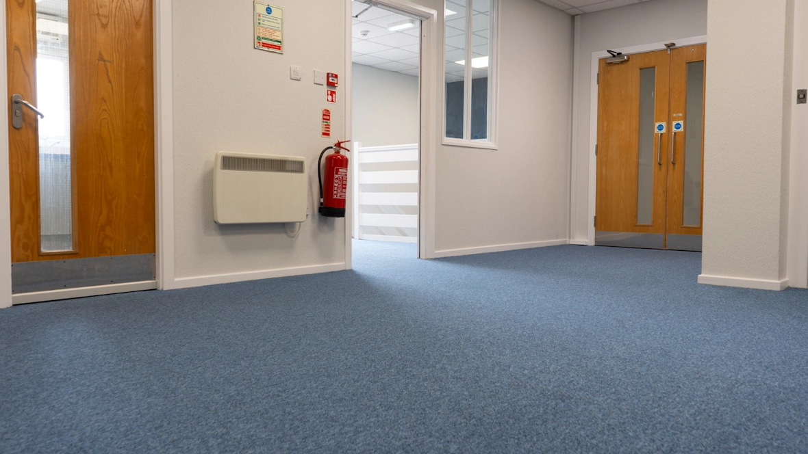 Office area with blue carpet